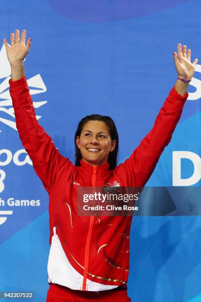 Gold medalist Aimee Willmott of England poses during the medal ceremony for the Women's 400m Individual Medley Final on day one of the Gold Coast...