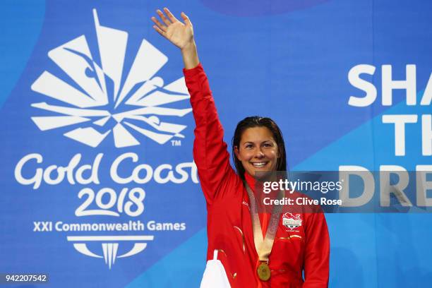 Gold medalist Aimee Willmott of England poses during the medal ceremony for the Women's 400m Individual Medley Final on day one of the Gold Coast...