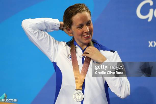 Silver medalist Hannah Miley of Scotland smiles during the medal ceremony for the Women's 400m Individual Medley Final on day one of the Gold Coast...