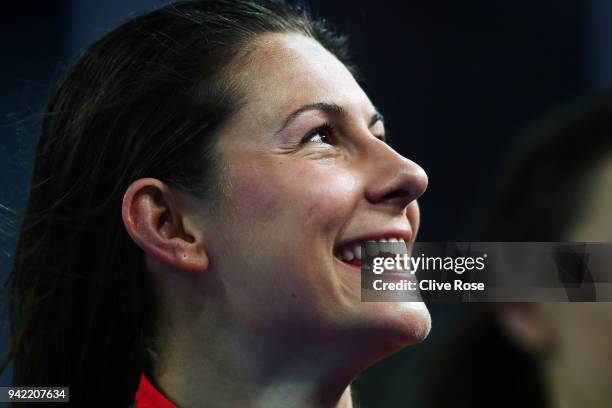 Gold medalist Aimee Willmott of England smiles during the medal ceremony for the Women's 400m Individual Medley Final on day one of the Gold Coast...