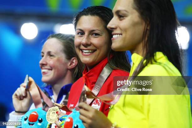 Silver medalist Hannah Miley of Scotland, gold medalist Aimee Willmott of England and bronze medalist Blair Evans of Australia pose during the medal...