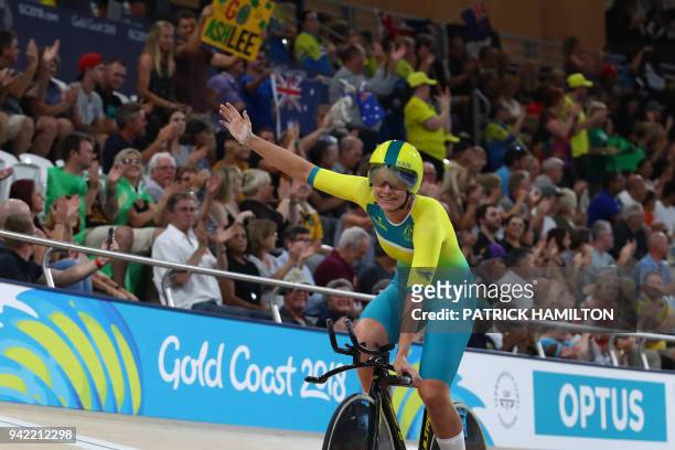 Australia's Ashlee Ankudinoff celebrates her team's gold medal win in the women's 4000m team pursuit finals track cycling event during the 2018 Gold...