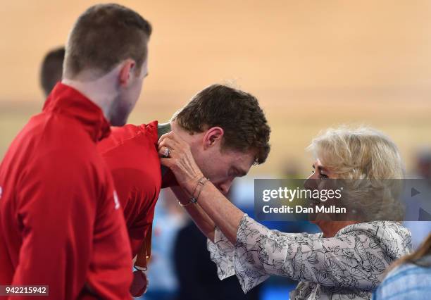 Silver medalists James Ball of Wales and pilot Peter Mitchell are presented with their medals by Camilla, Duchess of Cornwallduring the medal...