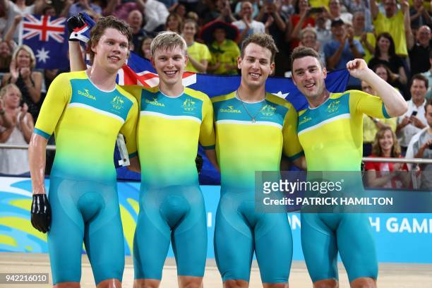 Australia's Kelland O'Brien, Alex Porter, Sam Welsford and Leigh Howard celebrate their gold medal win and new world record in the men's 4000m team...