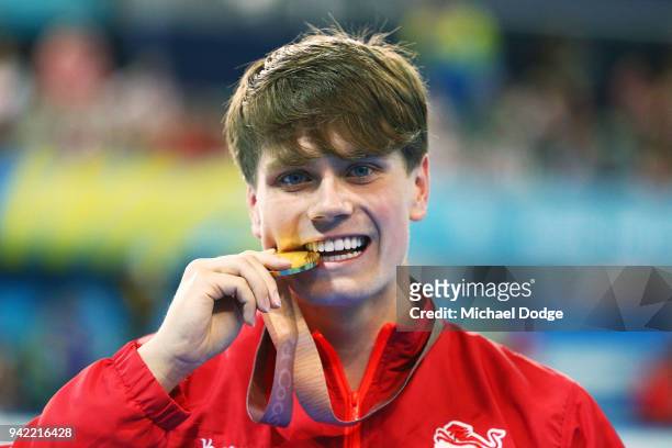 Gold medalist Thomas Hamer of England poses during the medal ceremony following the Men's S14 200m Freestyle Final on day one of the Gold Coast 2018...