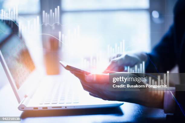 closeup view of businessman hand touching on smartphone. concept of digital diagram,graph interfaces,virtual screen,connections icon.blurred - investment research stock pictures, royalty-free photos & images