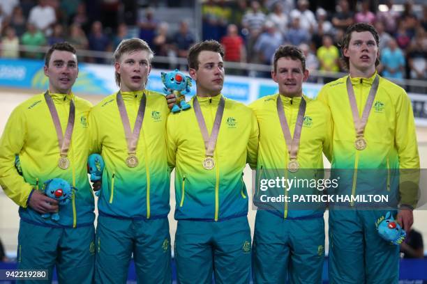 Australia team members Kelland O'Brien, Alex Porter, Sam Welsford, Jordan Kerby and Leigh Howard stand on the winner's podium for their gold medal...