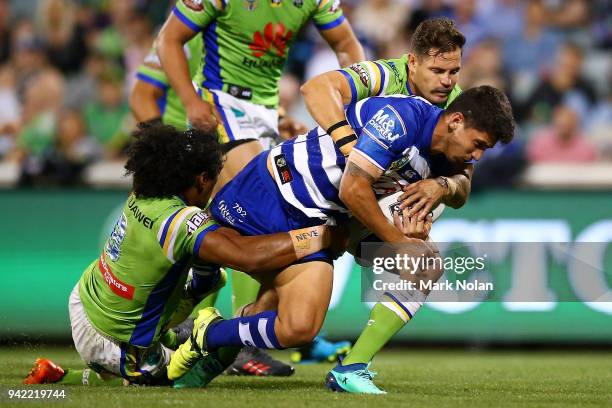 Jeremy Marshall-King of the Bulldogs is tackled during the round five NRL match between the Canberra Raiders and the Canterbury Bulldogs at GIO...