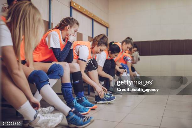 female volleyball team - high school locker room stock pictures, royalty-free photos & images