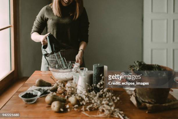 young hous wife mixing wiped cream - wife beater stock pictures, royalty-free photos & images