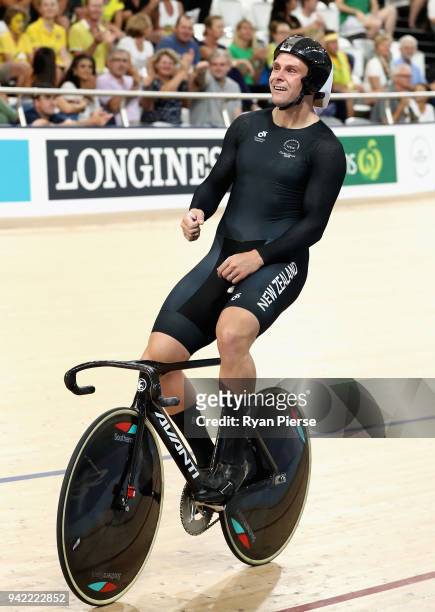 Edward Dawkins of New Zealand celebrates winning gold in the Men's Team Sprint Finals during the Cycling on day one of the Gold Coast 2018...