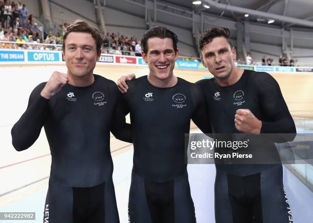 Edward Dawkins, Ethan Mitchell and Sam Webster of New Zealand celebrate winning gold in the Men's Team Sprint Finals during the Cycling on day one of...