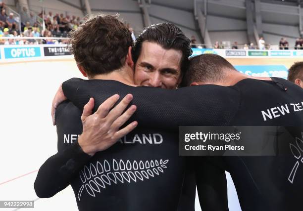 Edward Dawkins, Ethan Mitchell and Sam Webster of New Zealand celebrate winning gold in the Men's Team Sprint Finals during the Cycling on day one of...