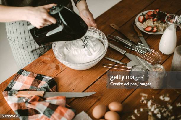 young hous wife mixing wiped cream - wife beater stock pictures, royalty-free photos & images