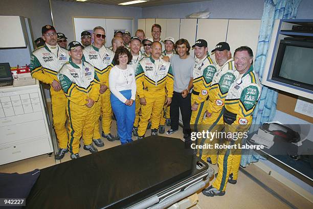 Alex Zanardi stands with the CART medical staff and Simple Green Safety Team, on July 6, 2002 that helped him survive his accident at the American...