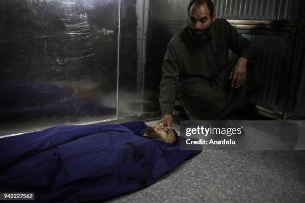 Dead body of 23-year-old Palestinian Nabil al- Hadri who has been killed in Israeli airstrike on Gaza laying on the floor in the morgue at Al-Shifa...