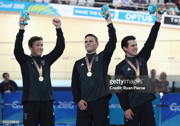 Gold medalists Edward Dawkins, Ethan Mitchell and Sam Webster of New Zealand celebrate during the medal ceremony for the Men's Team Sprint Finals...