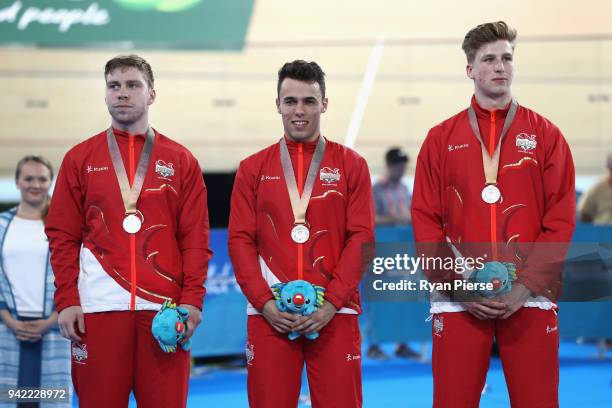 Philip Hindes, Ryan Owens and Joseph Truman of England celebrate silver in the Men's Team Sprint Final during the Cycling on day one of the Gold...