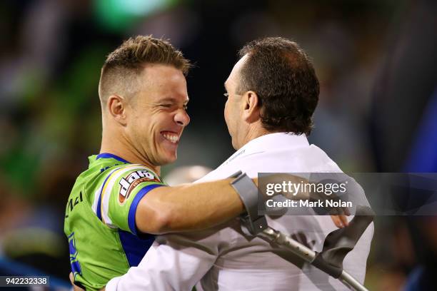 Sam Williams of the Raiders and Raiders coach Ricky Stuart celebrate after winning the round five NRL match between the Canberra Raiders and the...