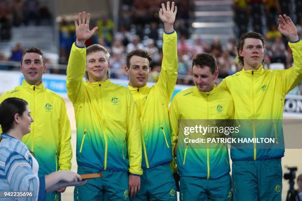 Australia team members Kelland O'Brien, Alex Porter, Sam Welsford, Jordan Kerby and Leigh Howard stand on the winner's podium for their gold medal...