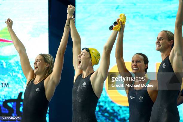 The Australia Women's 4 x 100m Freestyle Relay Final team celebrate victory and a new world record on day one of the Gold Coast 2018 Commonwealth...