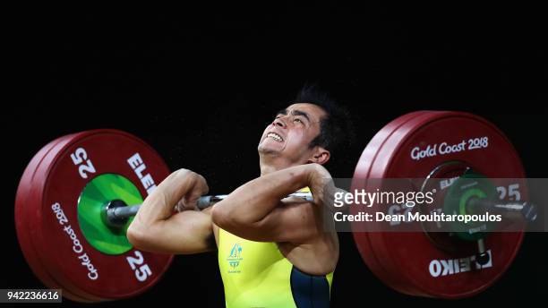 Vannara Be of Australia competes during the Weightlifting Men's 62kg Final on day one of the Gold Coast 2018 Commonwealth Games at Carrara Sports and...