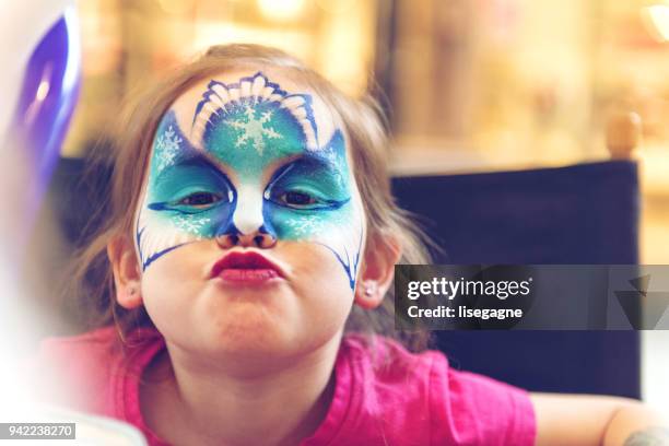 little girl having a face paint - war paint stock pictures, royalty-free photos & images