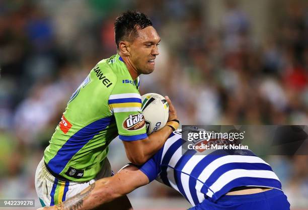 Jordan Rapana of the Raiders is tackled during the round five NRL match between the Canberra Raiders and the Canterbury Bulldogs at GIO Stadium on...