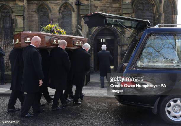 The coffin of Cardinal Keith O'Brien arrives for his funeral at the Church of St Michael in Newcastle.