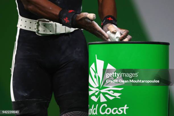 Poama Qaqa of Fiji reacts chalks his hands as he competes during the Weightlifting Men's 62kg Final on day one of the Gold Coast 2018 Commonwealth...