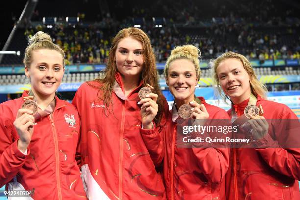 Bronze medalists Siobhan Marie O'connor, Freya Anderson, Anna Hopkin and Eleanor Faulkner of England pose during the medal ceremony for the Women's 4...