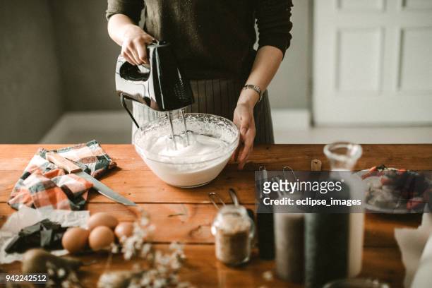 young hous wife mixing wiped cream - wife beater stock pictures, royalty-free photos & images