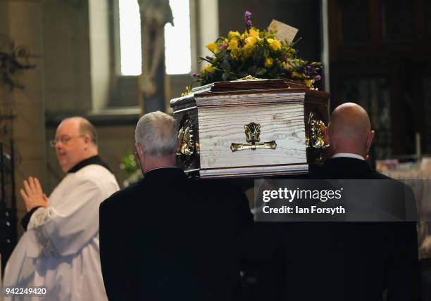 The coffin is carrried into the funeral of Cardinal Keith Patrick O'Brien, formerly the Catholic Church's most senior figure in the country takes...