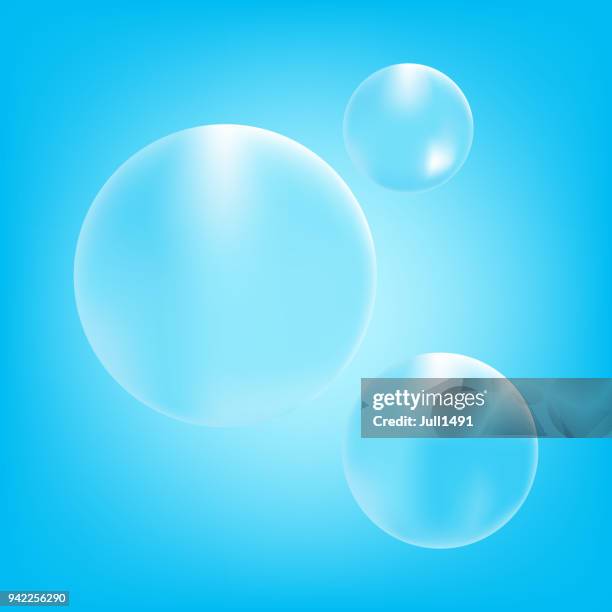 the realistic group of bubbles on a blue bright background. - soap bubbles transparent stock illustrations