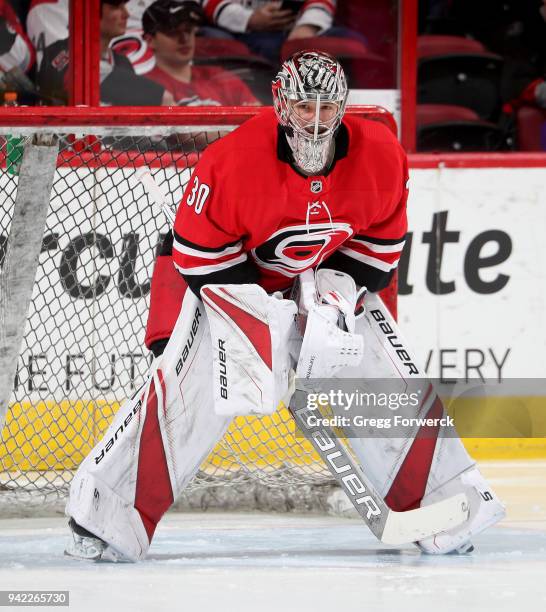 Cam Ward of the Carolina Hurricanes crouches in the crease during warm ups prior to and NHL game against the New York Rangers on March 31, 2018 at...