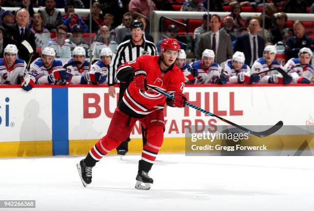Sebastian Aho of the Carolina Hurricanes passes the puck during an NHL game against the New York Rangers on March 31, 2018 at PNC Arena in Raleigh,...