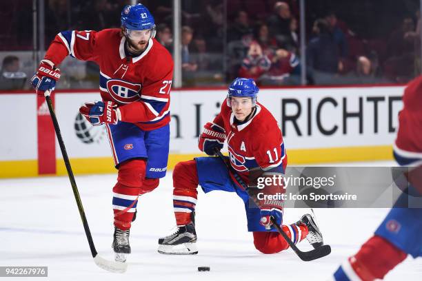 Montreal Canadiens Winger Alex Galchenyuk starts skating while Montreal Canadiens Right Wing Brendan Gallagher kneels on the ice at warm-up before...