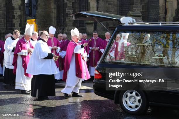 The coffin of Cardinal Keith O'Brien leaves the Church of St Michael in Newcastle, after his funeral service.