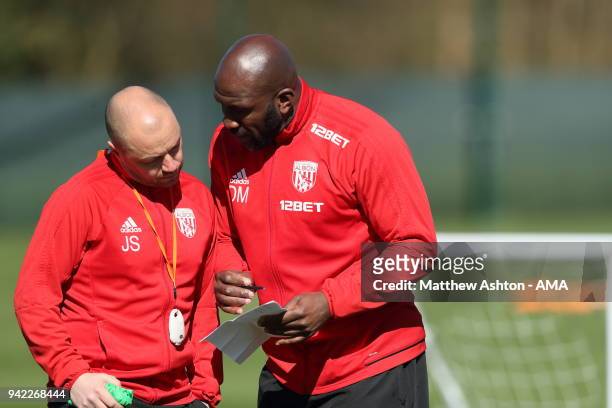 Darren Moore the West Bromwich Albion First Team Coach takes the training session with Jimmy Shan Senior Professional Development Phase Coach during...