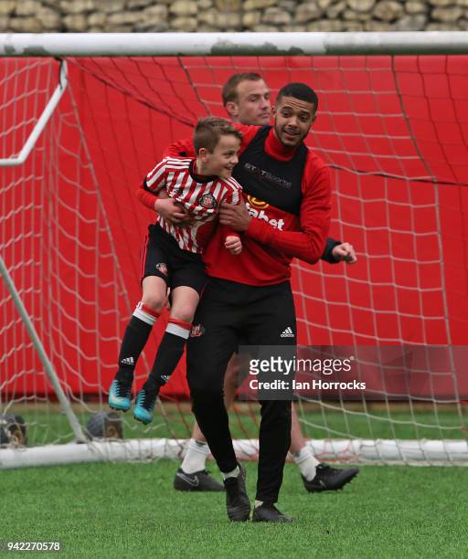 Jake Clarke-Salter uses his height against an under 9 player during a training session between the First Team and the under 9's at The Academy of...