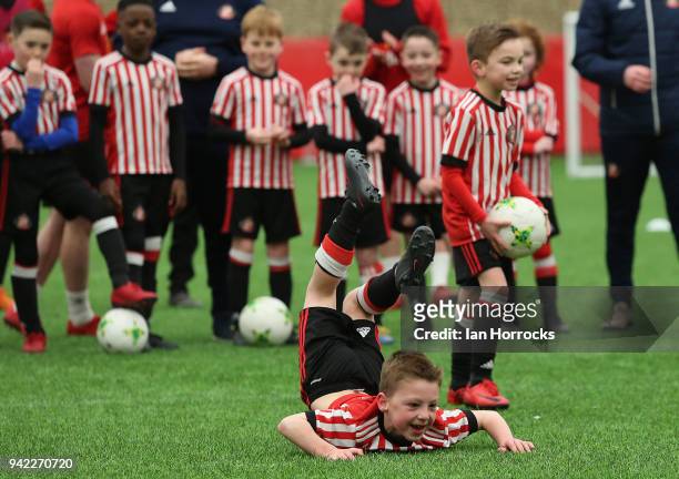 Under 9's player celebrates scoring whilst taking penalties against the first team during a training session between the First Team and the under 9's...