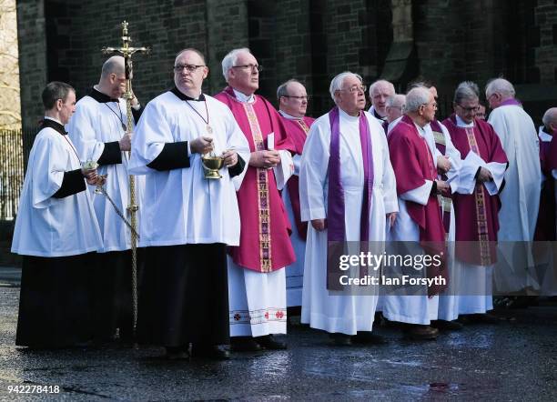 Members of the Catholic church gather after the service as they wait following the funeral of Cardinal Keith Patrick O'Brien, formerly the Catholic...