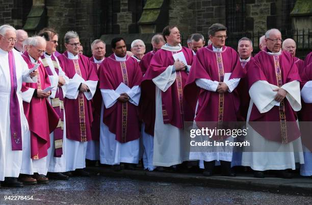 Members of the Catholic church gather after the service as they wait following the funeral of Cardinal Keith Patrick O'Brien, formerly the Catholic...