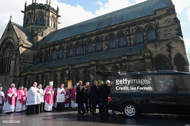 Members of the Catholic church gather after the service as they wait following the funeral of Cardinal Keith Patrick O'Brien, formerly the Catholic...