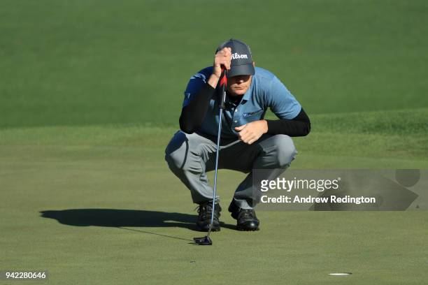 Brendan Steele of the United States lines up his putt on the second green during the first round of the 2018 Masters Tournament at Augusta National...