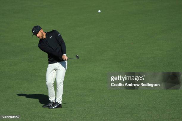 Kevin Chappell of the United States chips on the second hole during the first round of the 2018 Masters Tournament at Augusta National Golf Club on...