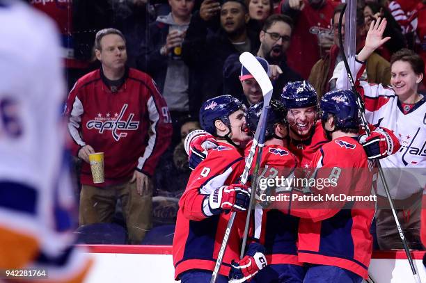 Alex Chiasson of the Washington Capitals celebrates with his teammates after scoring a third period goal against the New York Islanders at Capital...