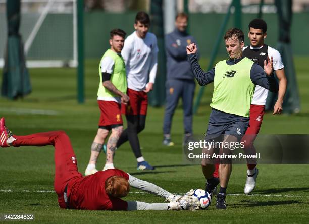 Conall Murtagh First-team fitness coach and Adam Bogdan of Liverpool during a training session at Melwood Training Ground on April 5, 2018 in...