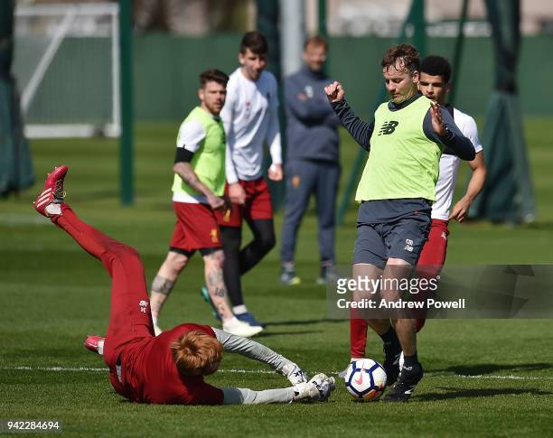 Conall Murtagh First-team fitness coach and Adam Bogdan of Liverpool during a training session at Melwood Training Ground on April 5, 2018 in...