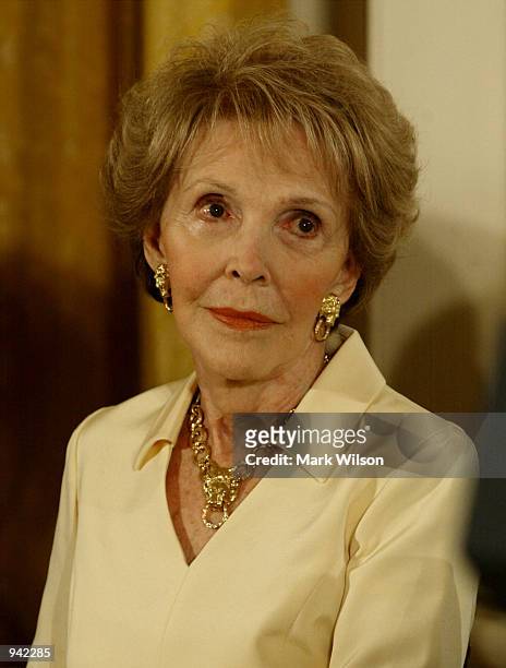 Former first lady Nancy Reagan listens to her introduction before receiving the Presidential Medal of Freedom from U.S. President George W. Bush...
